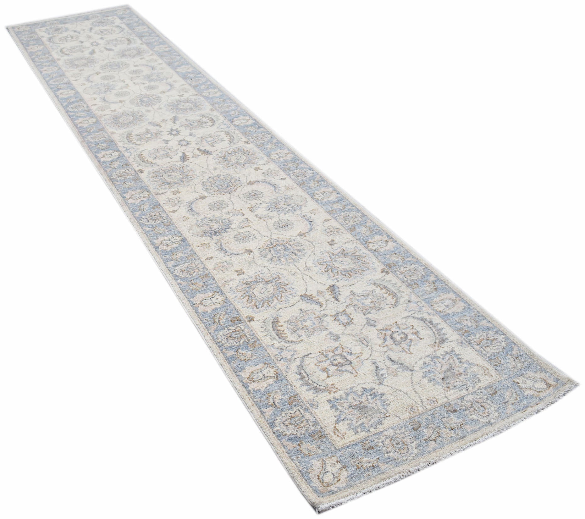 An Afghan Chobi runner rug featuring a traditional floral pattern in soft blue and cream tones.