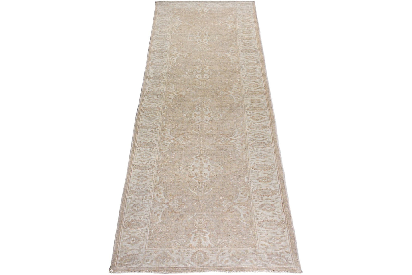 An Afghan Chobi runner rug featuring a traditional beige and cream floral pattern.
