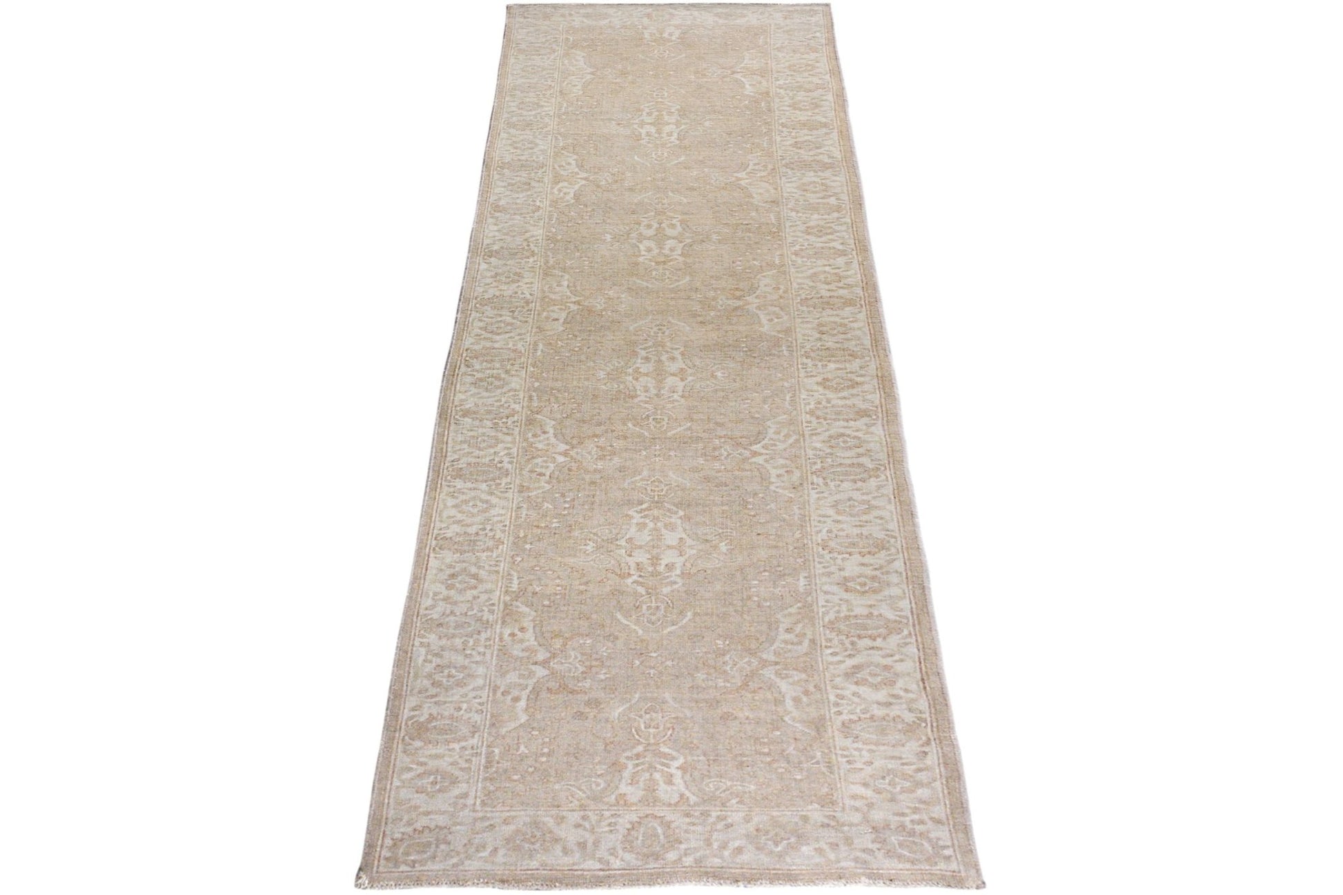 An Afghan Chobi runner rug featuring a traditional beige and cream floral pattern.
