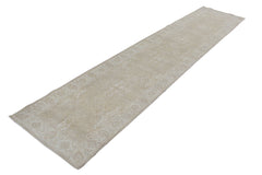 A long, handmade Afghan Chobi runner rug featuring a traditional pattern in neutral beige tones.