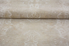 A handmade Afghan Chobi runner featuring a traditional beige floral pattern in handspun wool.