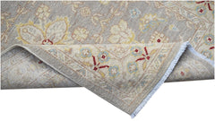 A hand-knotted Afghan Chobi runner featuring traditional floral patterns in soft, earthy tones.