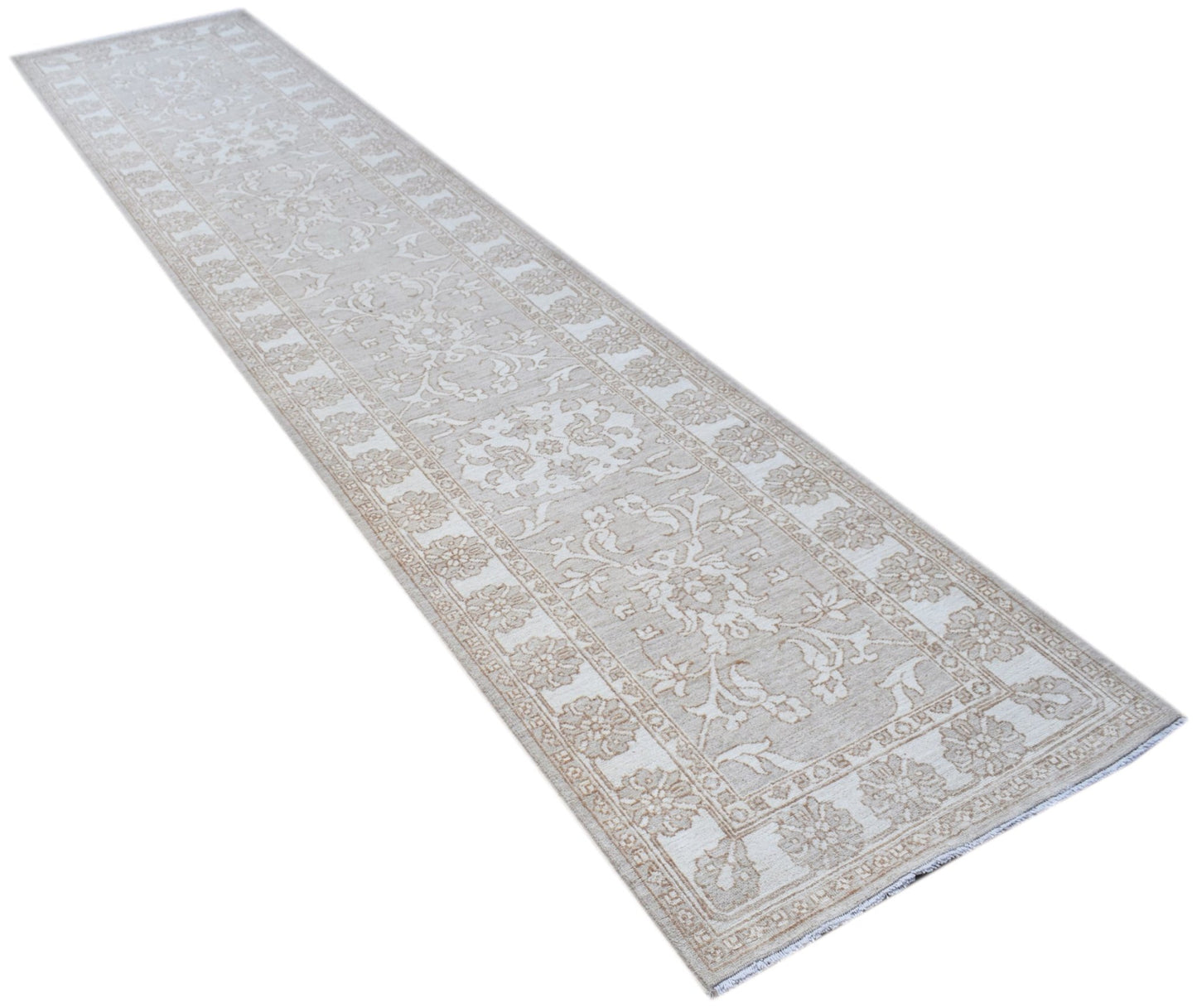 A long, hand-knotted Afghan Chobi runner rug featuring a traditional floral pattern in beige tones.
