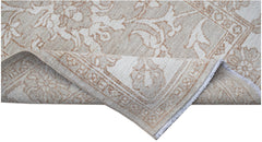 A hand-knotted Afghan Chobi runner featuring a traditional floral pattern in beige and cream tones.