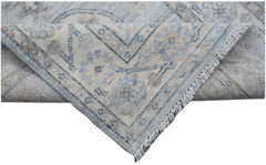A handmade Afghan Chobi runner featuring a traditional floral pattern in soft blue and beige tones.