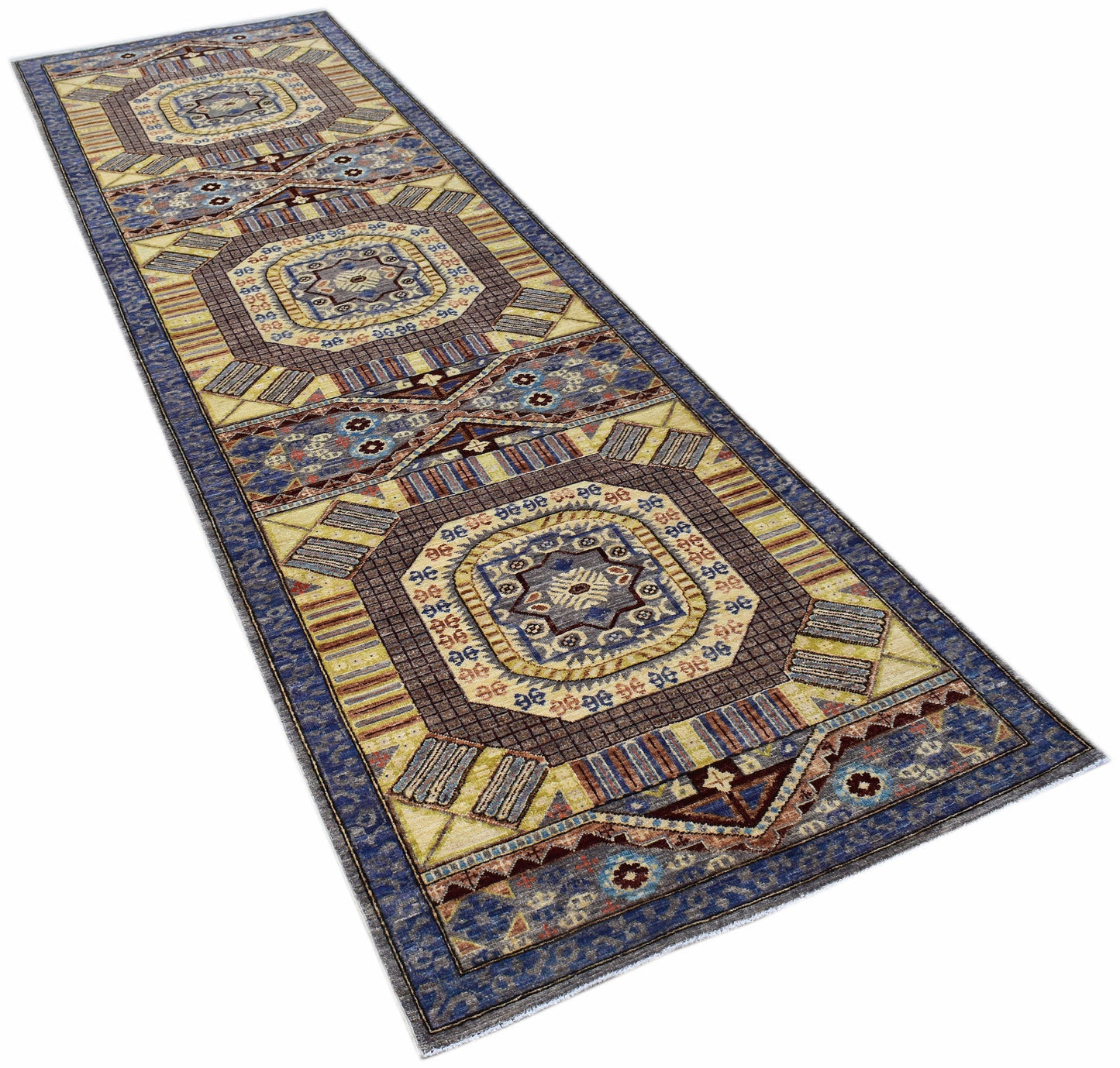 A handmade Afghan Chobi runner featuring geometric patterns in blue, brown, and cream tones.