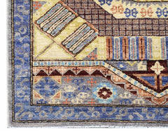 A handmade Afghan Chobi runner featuring geometric patterns in blue, yellow, and brown tones.