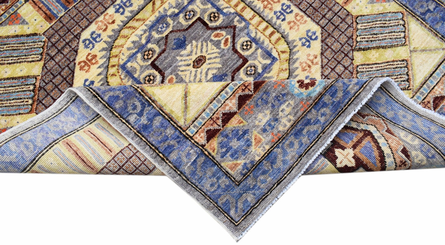 A handwoven Afghan Chobi runner featuring a geometric pattern in blue, yellow, and brown tones.