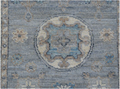 A handmade Afghan Chobi runner featuring a traditional blue and beige geometric medallion pattern.