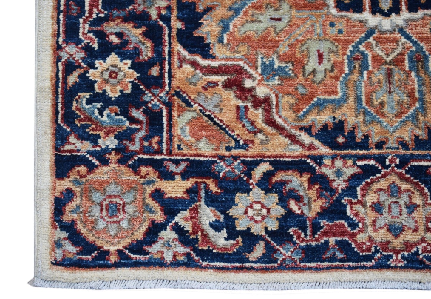 A handwoven Afghan Chobi runner featuring a traditional floral pattern in blue, orange, and red.