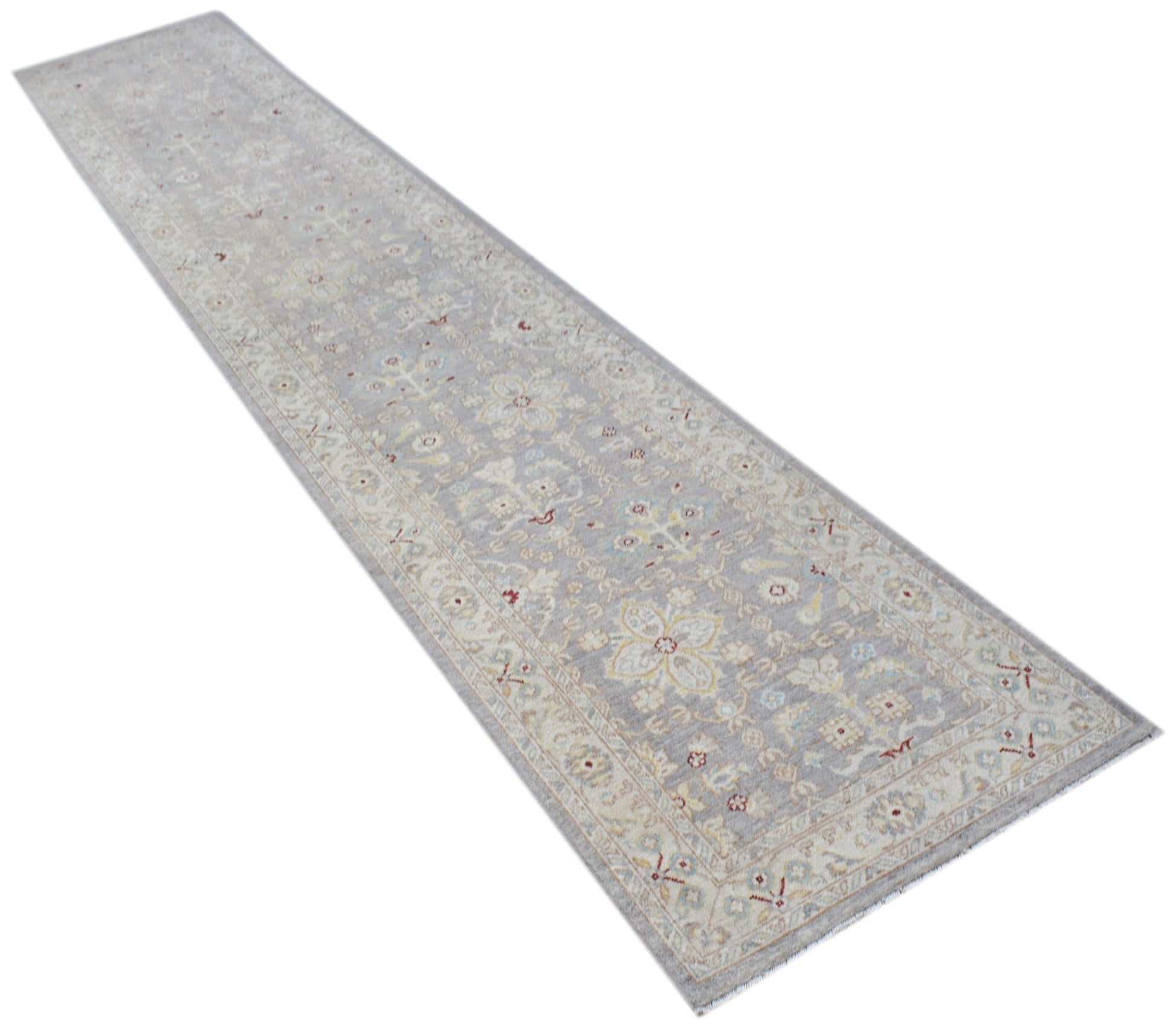 An Afghan Chobi runner rug featuring a traditional floral pattern in soft, neutral tones.