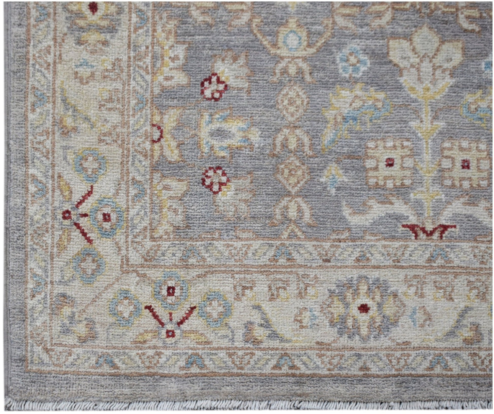 A handwoven Afghan Chobi runner featuring a traditional floral pattern in soft, earthy tones.