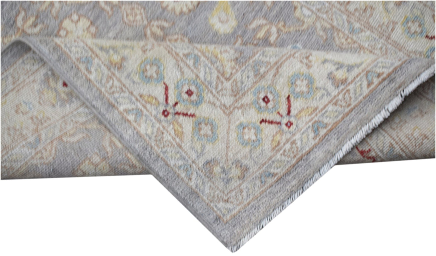 A handwoven Afghan Chobi runner featuring a traditional floral pattern in soft neutral tones.