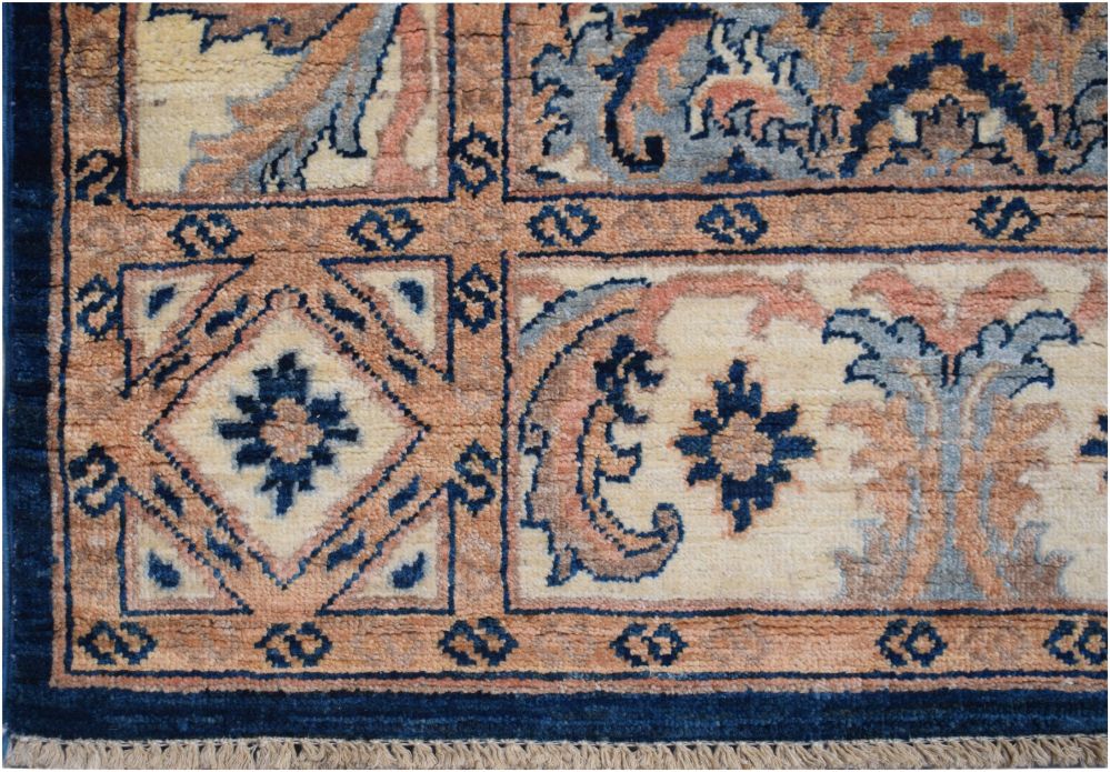 Handmade Afghan Chobi runner featuring a geometric grid pattern in blue, cream, and terracotta.