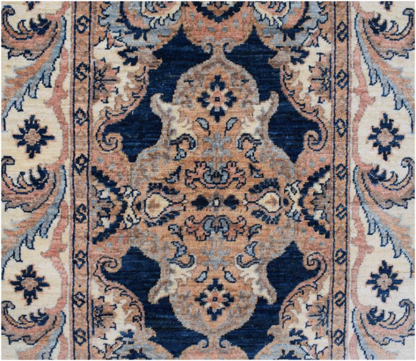 An Afghan Chobi runner featuring a traditional floral medallion pattern in blue and tan tones.