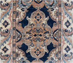 An Afghan Chobi runner featuring a traditional floral medallion pattern in blue and tan tones.