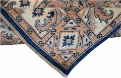 A handmade Afghan Chobi runner featuring a traditional geometric pattern in blue and tan tones.