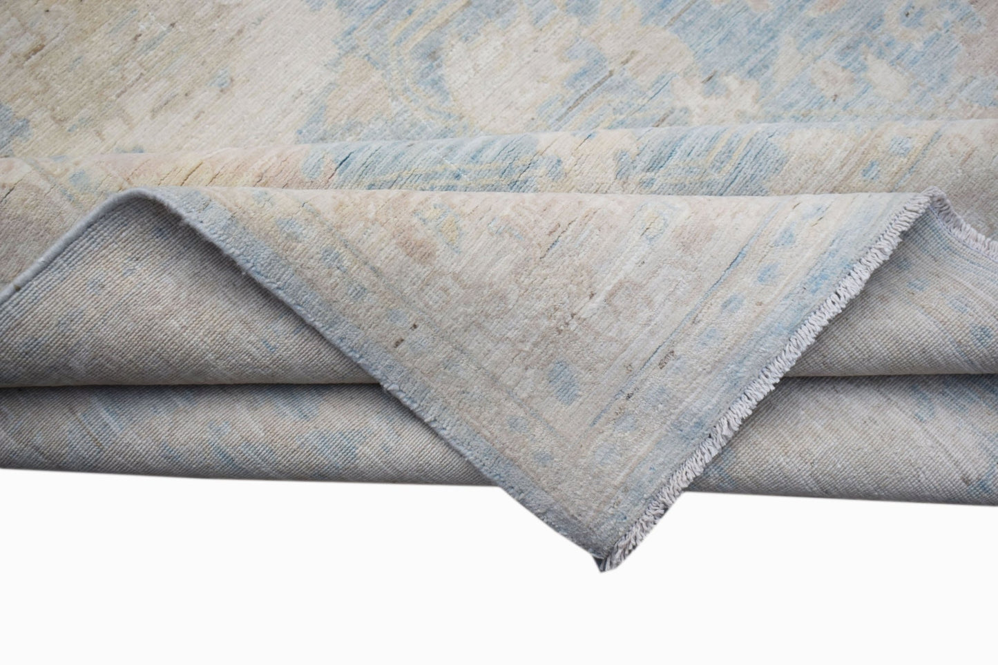 A handwoven Afghan Chobi runner featuring a traditional pattern in soft blue and beige tones.