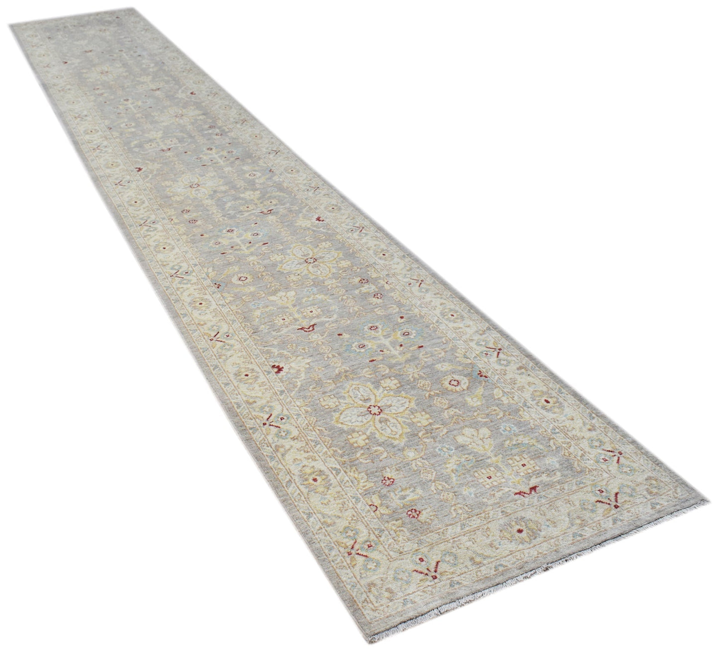 An Afghan Chobi runner rug featuring a traditional floral pattern in soft, neutral wood tones.
