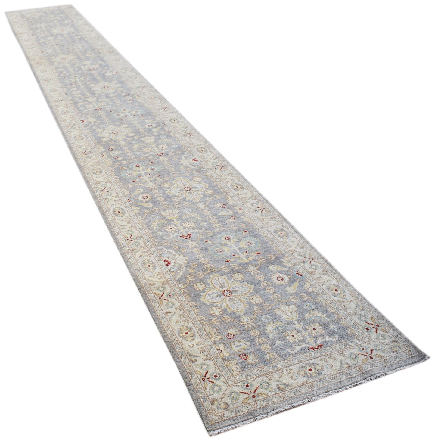 A long, handmade Afghan Chobi runner rug featuring a traditional floral pattern in soft grey tones.