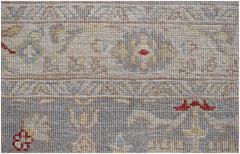 A close-up of an Afghan Chobi runner featuring intricate floral patterns in muted earth tones.