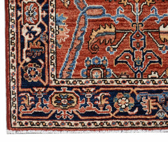 A handmade Afghan Chobi runner featuring intricate floral patterns in red, blue, and cream tones.