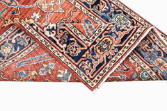 A handmade Afghan Chobi runner featuring a traditional floral pattern in red, blue, and cream.