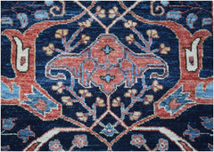 A close-up of an Afghan Chobi runner featuring a traditional floral pattern in blue and red tones.