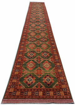 A long, handwoven Afghan Chobi runner rug featuring a repeating diamond pattern in earthy tones.