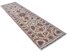 A handmade Afghan Chobi runner rug featuring a traditional Suzani floral pattern in earthy tones.