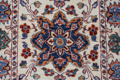 A handmade Afghan Chobi runner featuring a central floral medallion in blue, red, and gold tones.