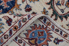A handmade Afghan Chobi runner featuring a traditional floral Suzani pattern in earthy tones.