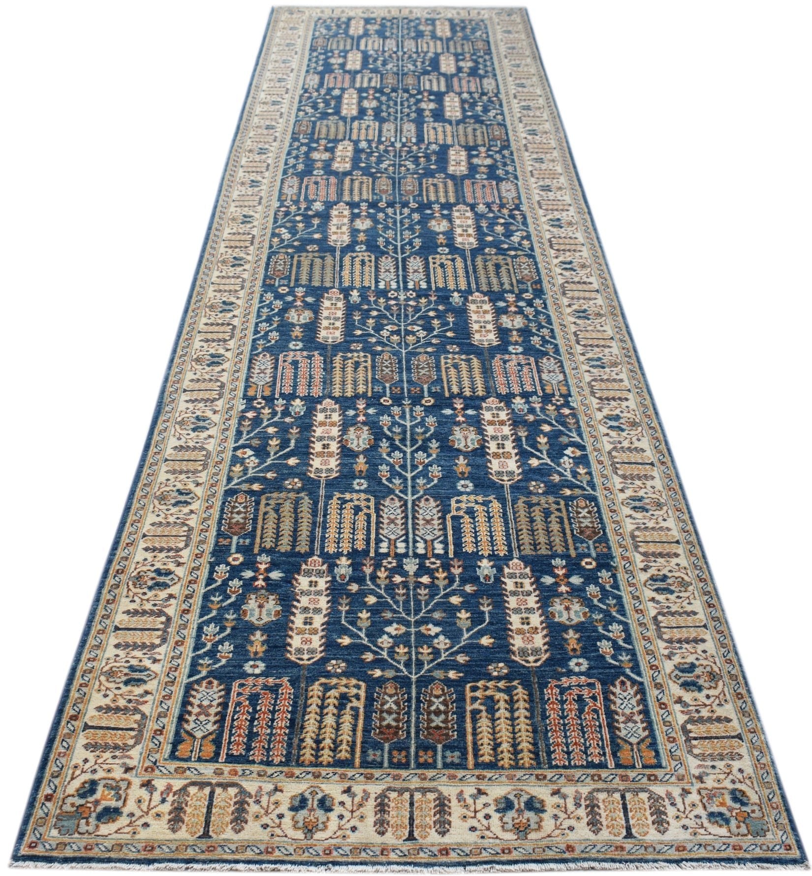 A handwoven Afghan Chobi runner featuring a traditional blue Tree of Life pattern.
