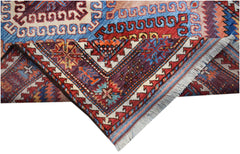 A handwoven Afghan Herati rug featuring intricate geometric patterns in vibrant wool colors.