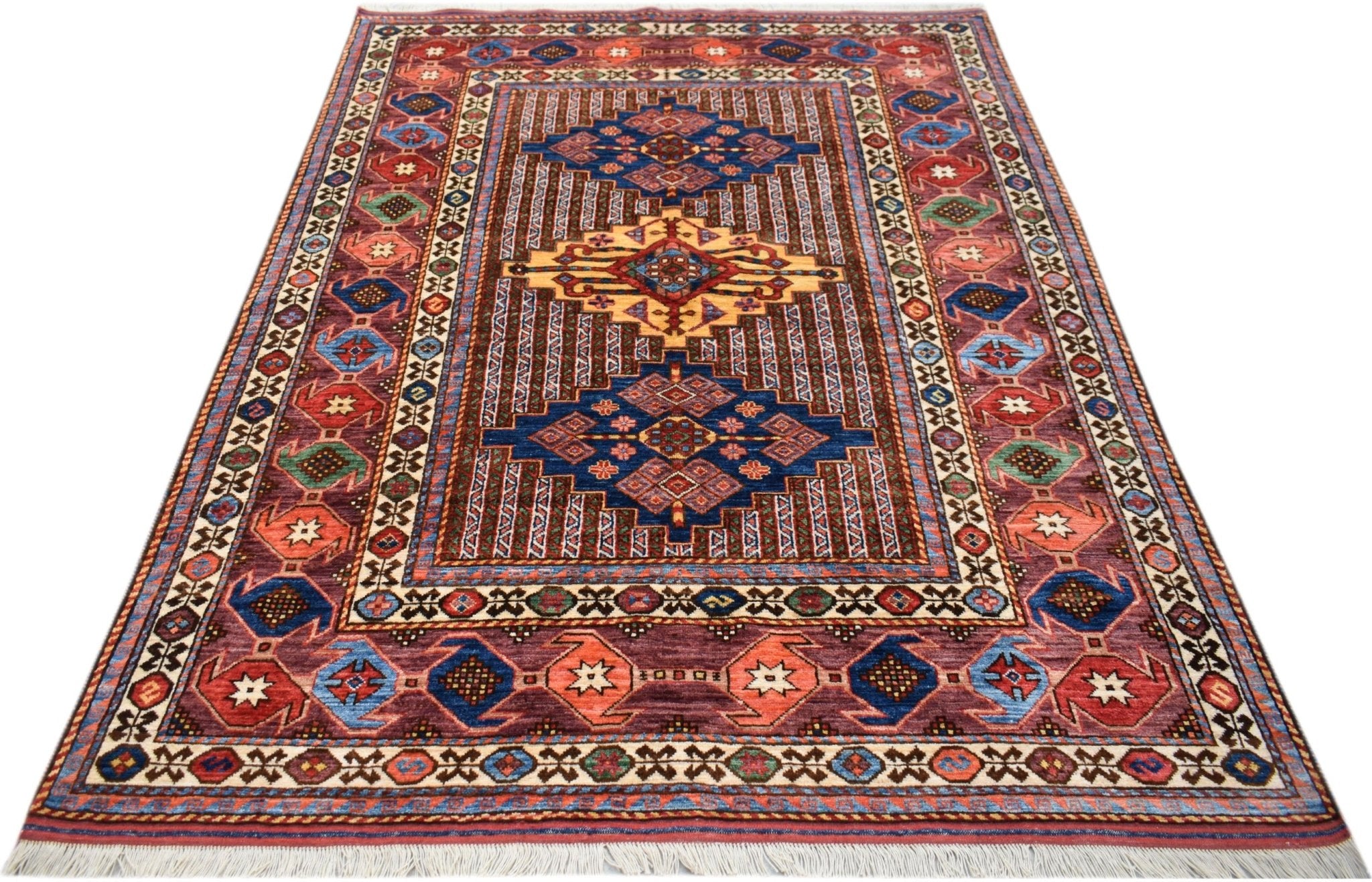 An Afghan Herati rug featuring a traditional geometric pattern in shades of blue, red, and gold.