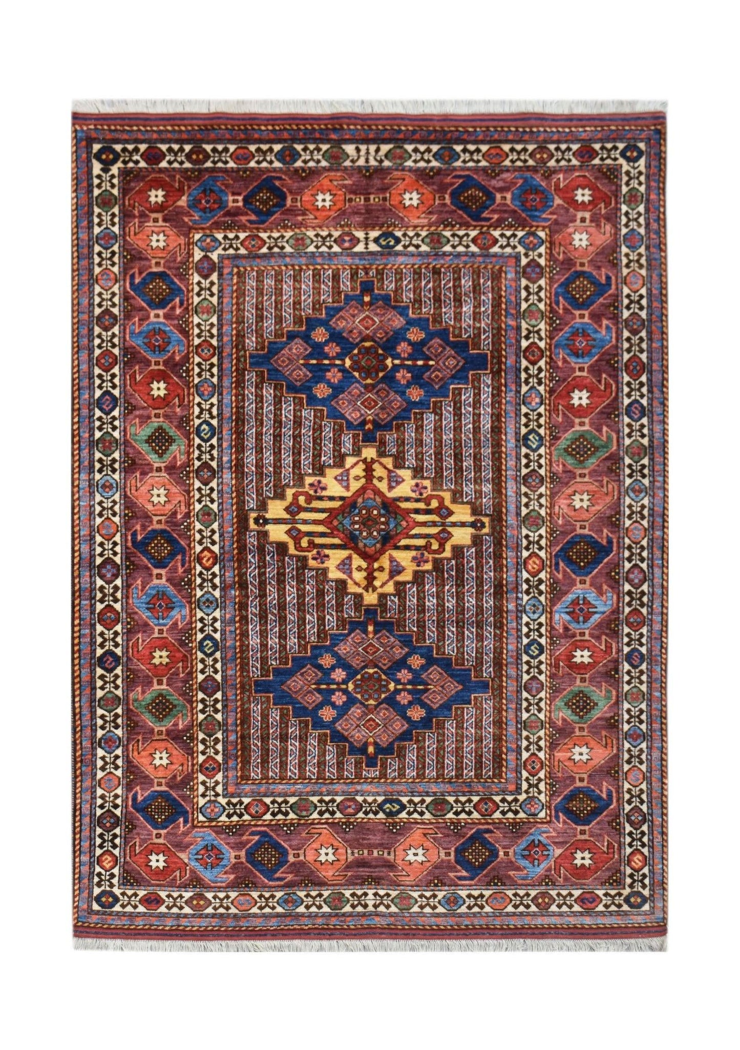 Handmade Afghan Herati rug featuring a geometric medallion pattern in blue, red, and yellow tones.