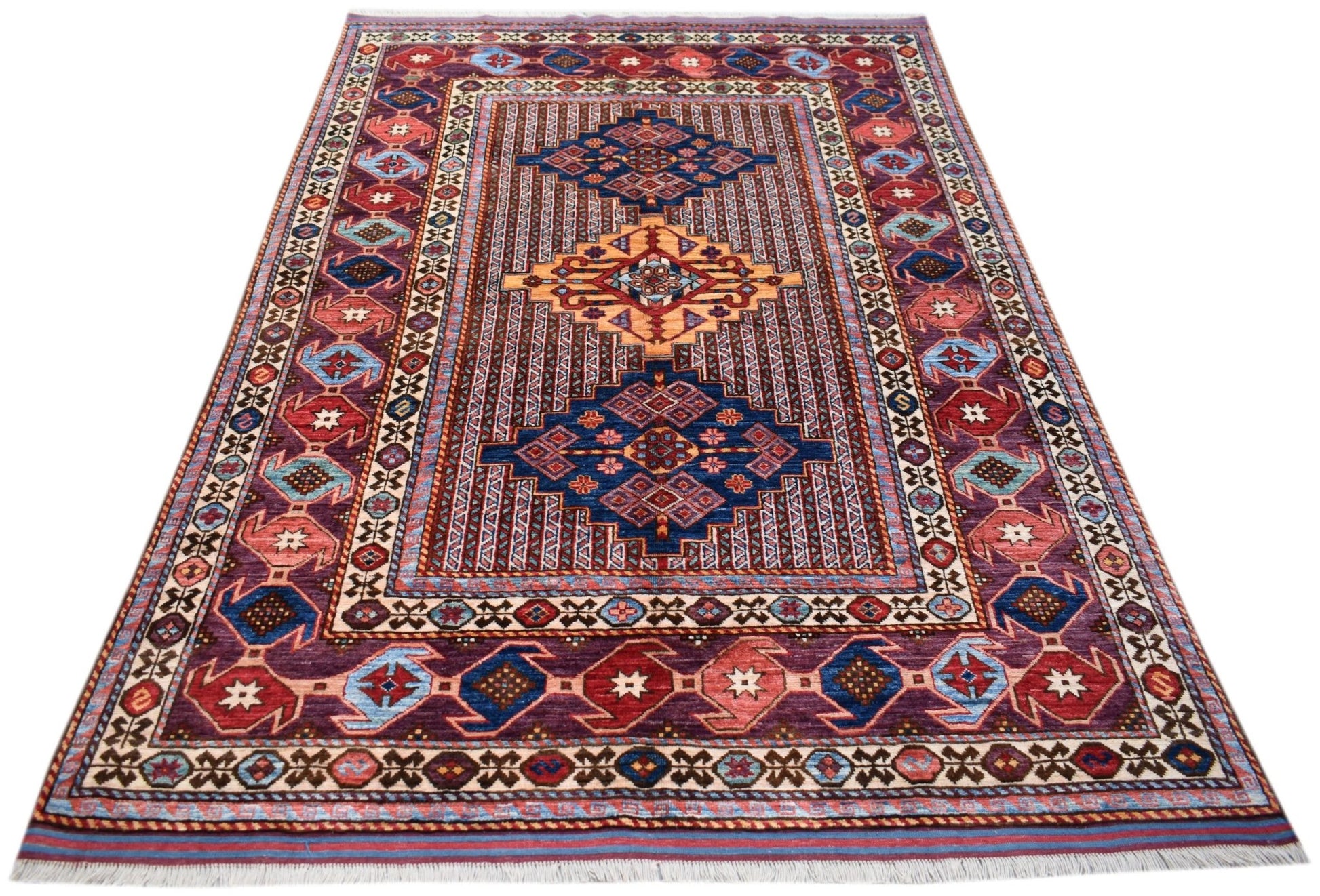 Handwoven Afghan Herati rug featuring a geometric pattern in shades of red, blue, and gold.