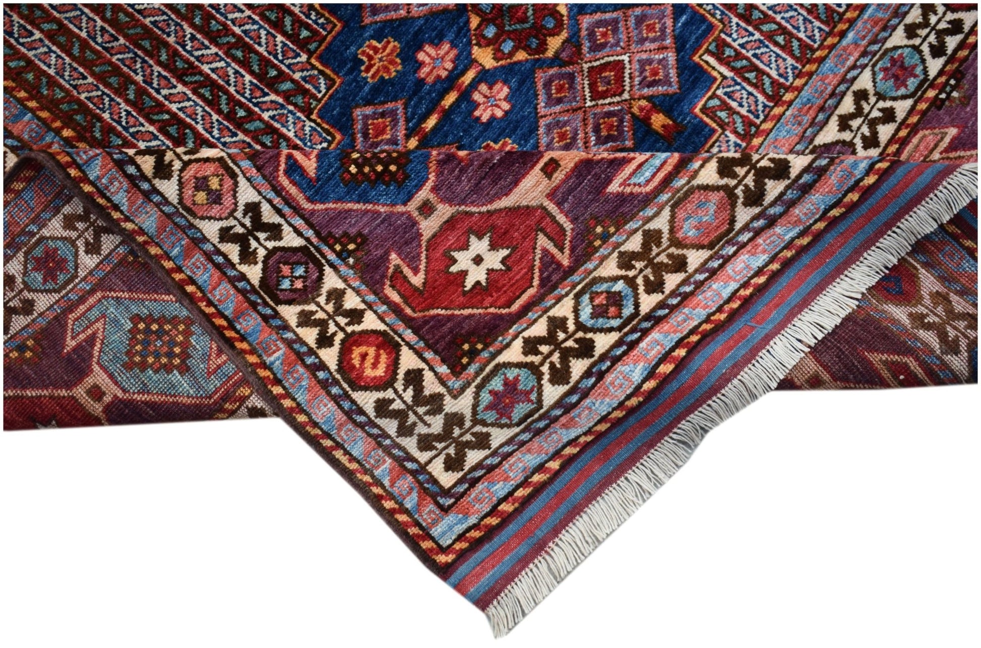 A handwoven Afghan Herati rug featuring intricate geometric patterns in blue, red, and purple.