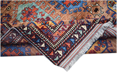 A handwoven Afghan Herati rug featuring intricate geometric patterns in vibrant wool colors.