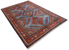 A rectangular Afghan Herati rug featuring a geometric diamond pattern in blue and red tones.