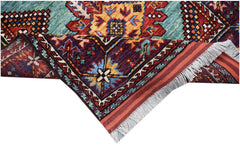 A handwoven Afghan Herati runner featuring a vibrant geometric pattern in wool with fringe ends.