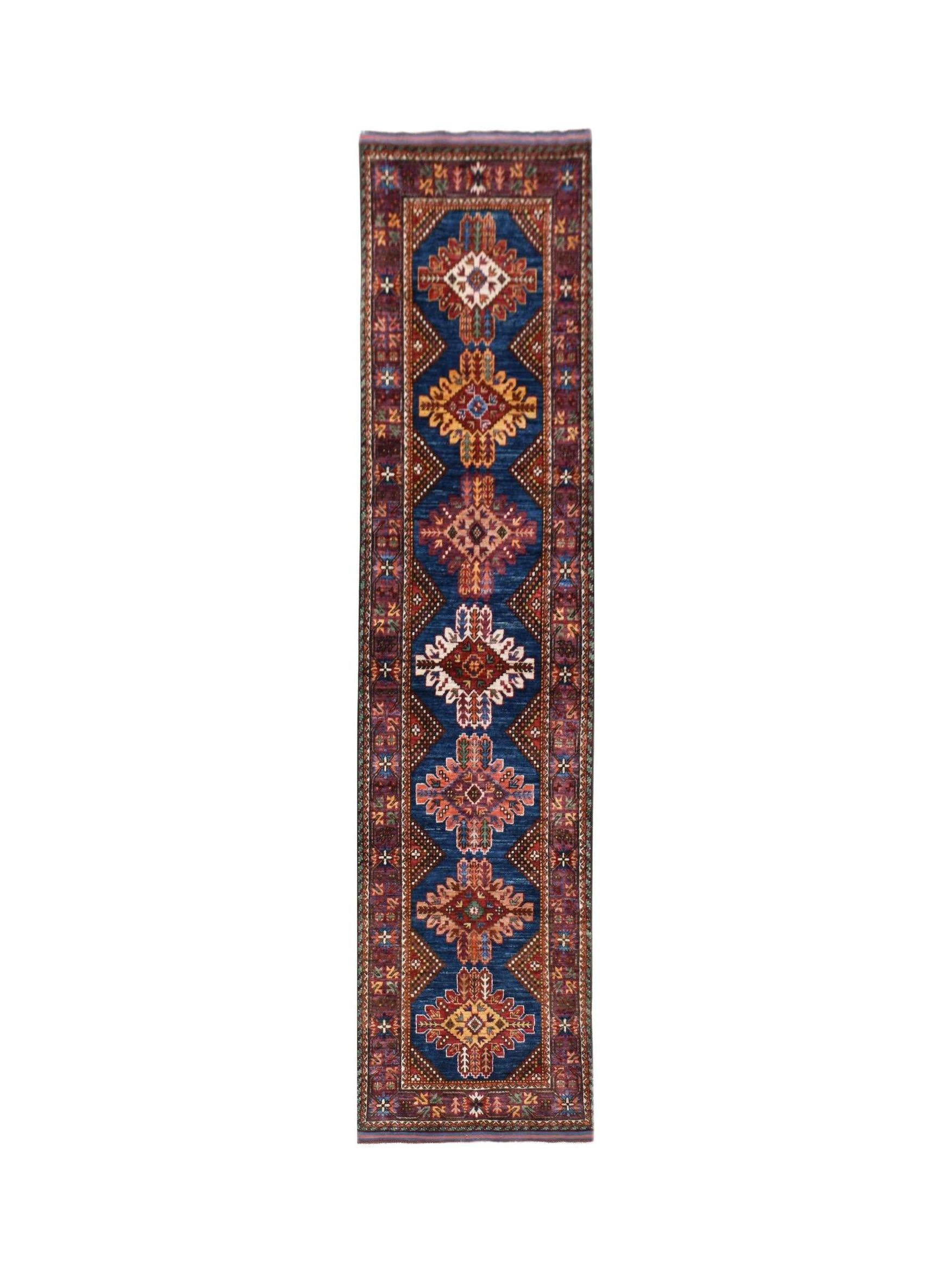 Handwoven Afghan Herati runner rug featuring a blue field with repeating geometric floral motifs.