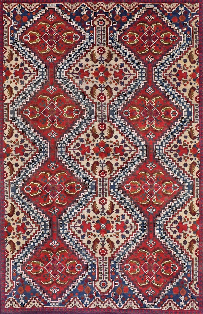 Handmade Afghan Khal Mohammadi wool rug featuring a repeating geometric diamond pattern in red.