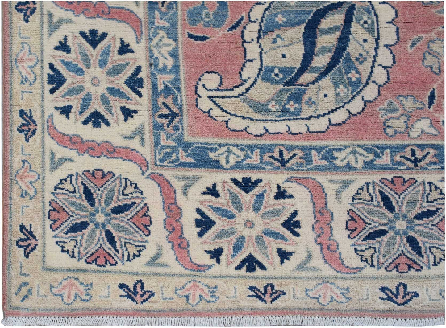 Handmade Afghan Kazakh rug featuring traditional floral motifs in blue, pink, and cream tones.