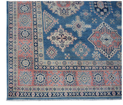 Handmade Afghan Kazakh rug featuring traditional geometric motifs in blue, pink, and cream.