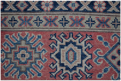 Handmade Afghan Kazakh rug featuring traditional geometric motifs in red, blue, and beige wool.