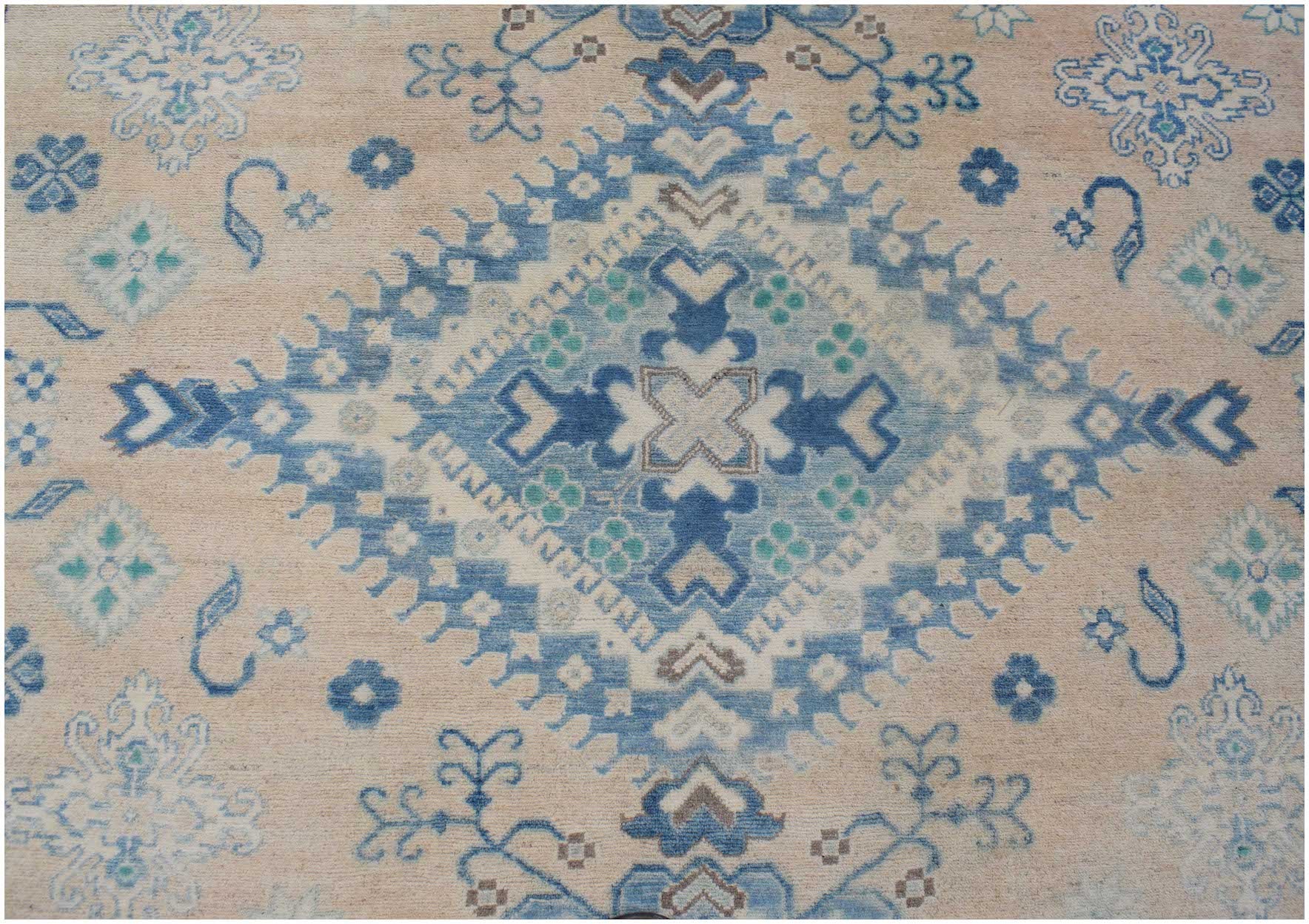 Handmade Afghan Kazakh rug featuring a central blue diamond motif on a beige wool background.