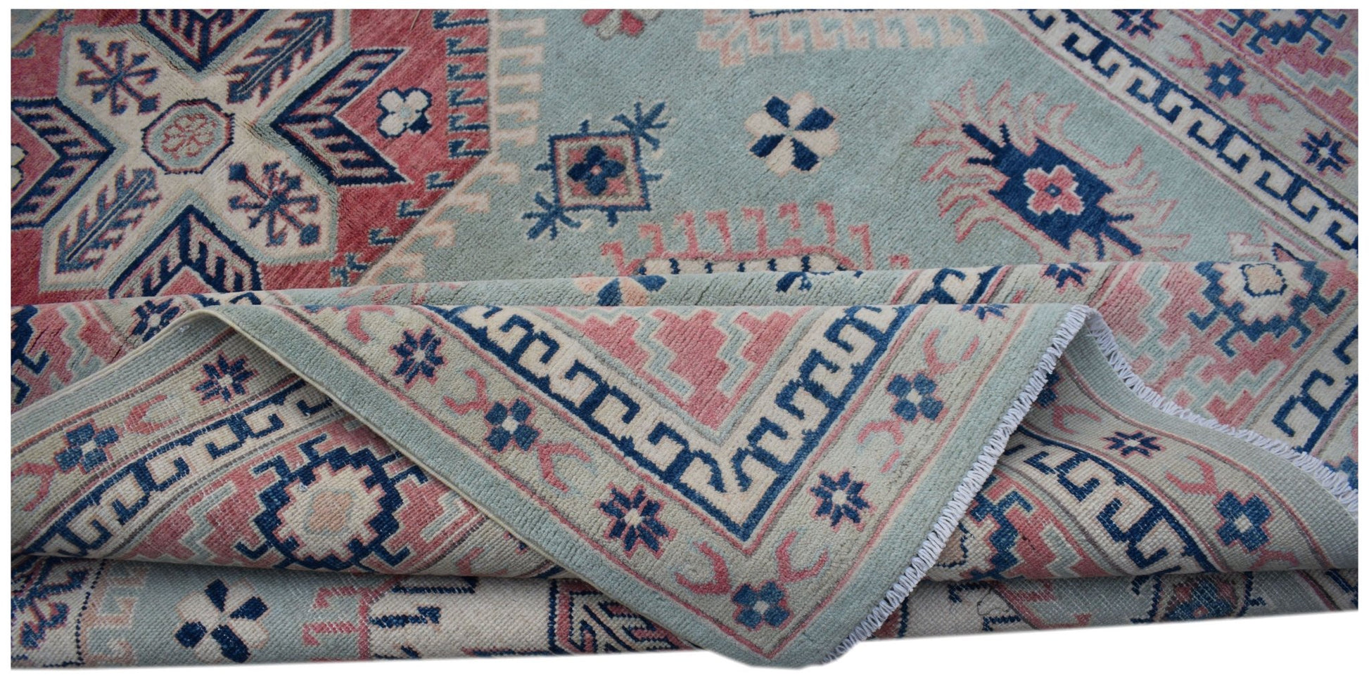 A handmade Afghan Kazakh rug featuring traditional geometric motifs in blue, pink, and cream.