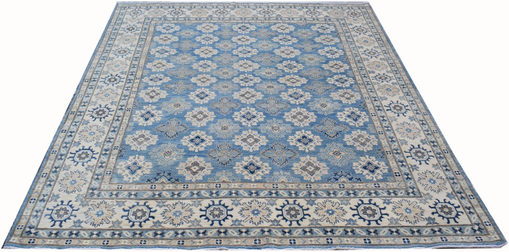 Handmade Afghan Kazakh rug featuring a repeating geometric pattern in shades of blue and beige.