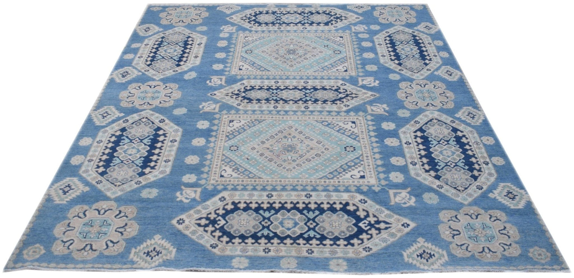 Handmade Afghan Kazakh rug featuring a geometric pattern in shades of blue, beige, and grey.